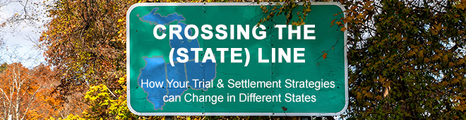 Crossing the (State) Line State sign nestled in fall leaves on tree with seminar title