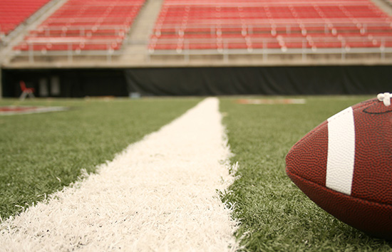 Football and bleachers football on field with bleachers