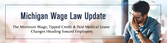 Concerned man clinches nose regarding Michigan Wage Law Updates Michigan Wage Law Update